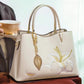 🌸Muttertagsrabatt 50%🌸Elegante bestickte Lilienhandtasche für Frauen Geschenkbox