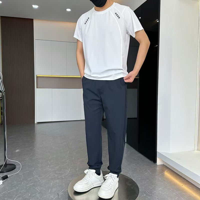 Set aus ultradünnem, atmungsaktivem Mesh-Sport-T-Shirt und langen Hosen